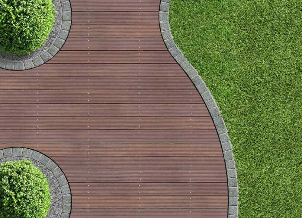 What is the best way to lay composite decking on grass?